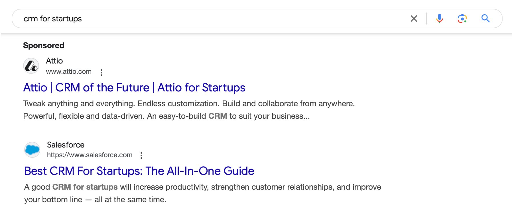 An example of PPC ads vs organic results for the search term crm for startups in Google showing sponsored listings on top and organic below